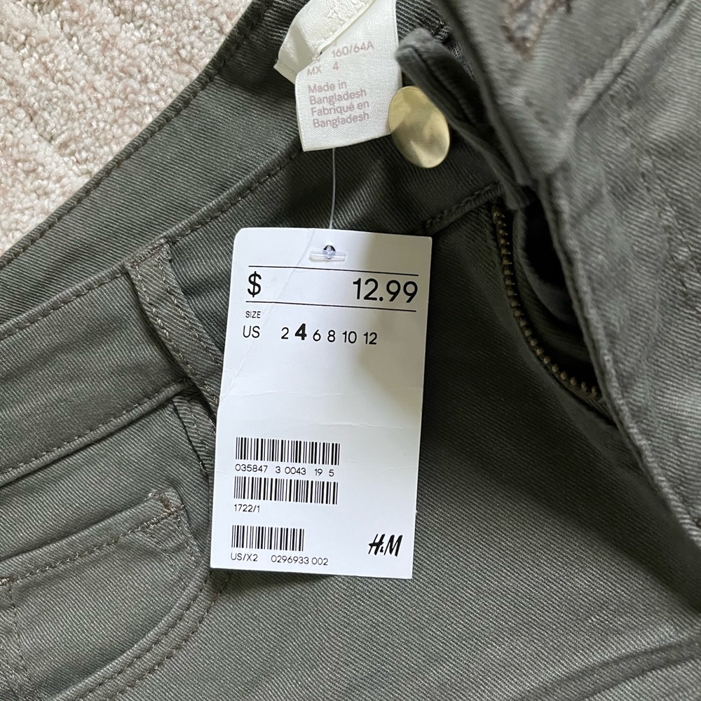 Never worn, green shorts